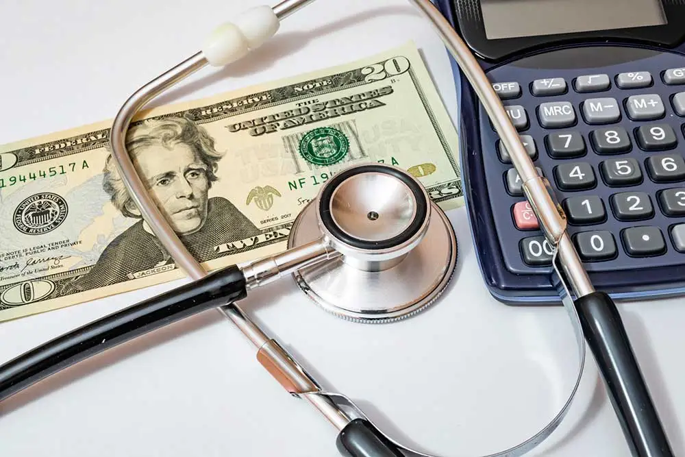 Older couple reviewing medical bills at home